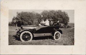 Four People in Old Automobile (Ford ??) Unused Real Photo Postcard G81