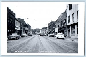 Monticello IA Postcard RPPC Photo First Street Cars Ferrall Drugs Store Hamms