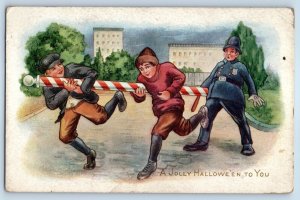 c1910's Halloween Policeman Chasing Boys With Barber's Pole Antique Postcard