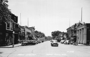 J74/ Sauk City Wisconsin RPPC Postcard c40-50s Street View Stores 123