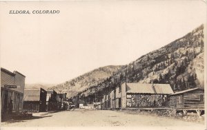 J32/ Eldora Colorado RPPC Postcard c1910 Stores Log Cabins Main St  25