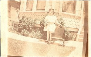 RPPC Postcard Girl Wood Chair Outside a Home 1910