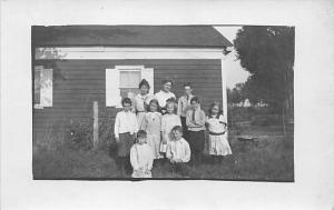 Kids in front of house Child, People Photo Writing on back 