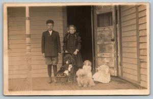 RPPC Bro & Sis on Porch w/4* Well-Dressed Dollies~Little Shaggy Dog to Boot~1910 