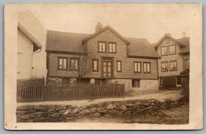 Postcard RPPC c1910s Denmark Old House Road View Fenced Terracotta Roof