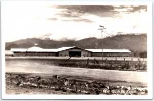 Landscape of American Barracks with Low Clouds - New Guinea - Vintage Postcard