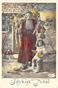 Brown Suited Santa Claus Christmas Holding Toys Little Girl Postcard