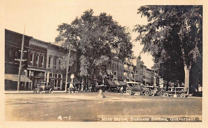 Gouverneur NY Main Street Storefronts Old Cars Real Photo Postcard