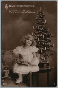 LITTLE GIRL w/ DOLL UNDER CHRISTMAS TREE ANTIQUE REAL PHOTO POSTCARD RPPC