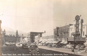 J19/ Colorado Springs RPPC Postcard c1940s Pikes Peak Stores Autos  143