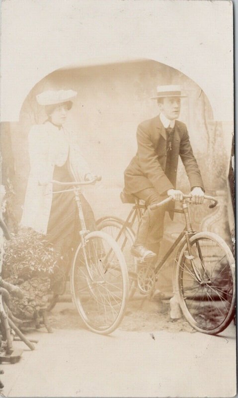 Man & Woman on Bicycles Studio Portrait 'Minnie & David Day' RPPC Postcard F99