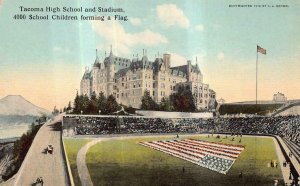 HIGH SCHOOL & STADIUM HUMAN FLAG TACOMA WASHINGTON POSTCARD (c. 1910)