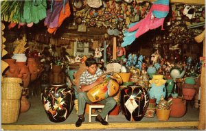 postcard Mexico - Pottery Painter in shop along Avenida Revolucion - Main Street