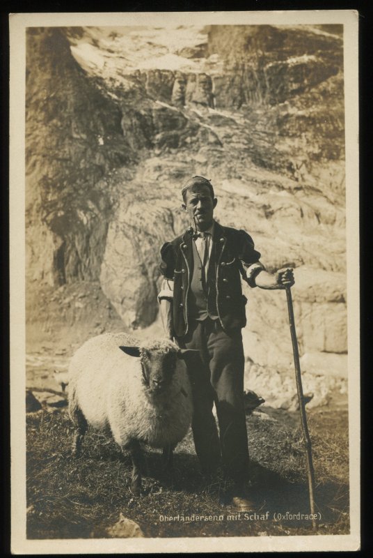 Alpine herdsman with sheep. RPPC by Perrochet-Matile, Lausanne, Switzerland