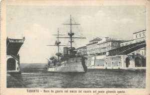 Lot283 taranto warship in middle of canal with open swing bridge italy ship