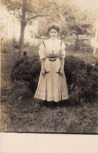 1910s RPPC Real Photo Postcard Ms Ruff Standing Outside In Dress Grass