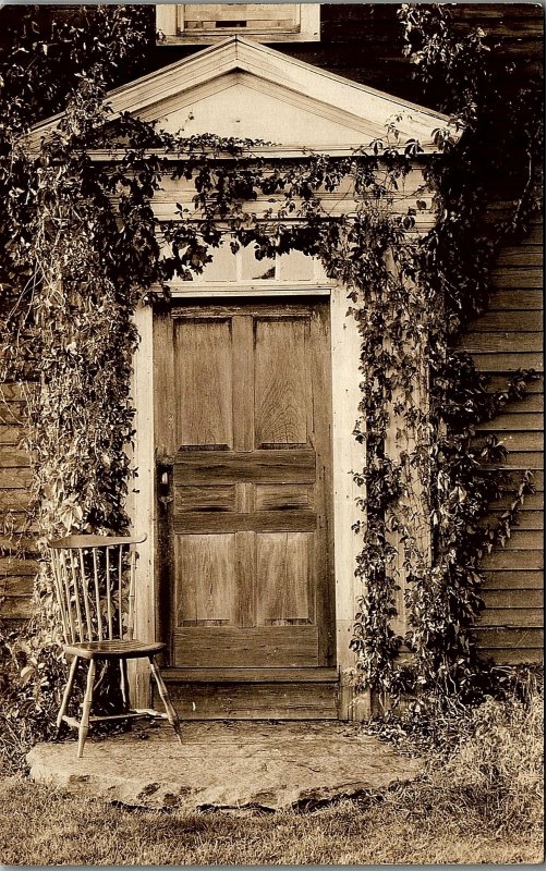 c1920 WESTMINISTER MASS DOOR WITH IVY AND CHAIR REAL PHOTO POSTCARD 17-71