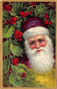 Christmas Greetings Santa Claus Head Purple Hat Ivy Berries Embossed Postcard