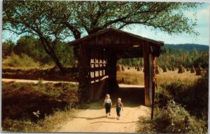 Covered Bridge at Chicamauga Creek with young children walking