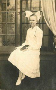 Bible Teen girl Hair bow Interior C-1910 RPPC Photo Religion Postcard 21-1751