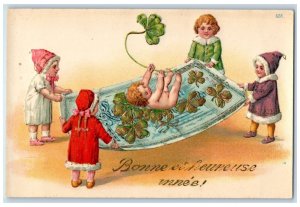 New Year Postcard Bonne Anne Children Playing Baby Shamrock Embossed c1910's