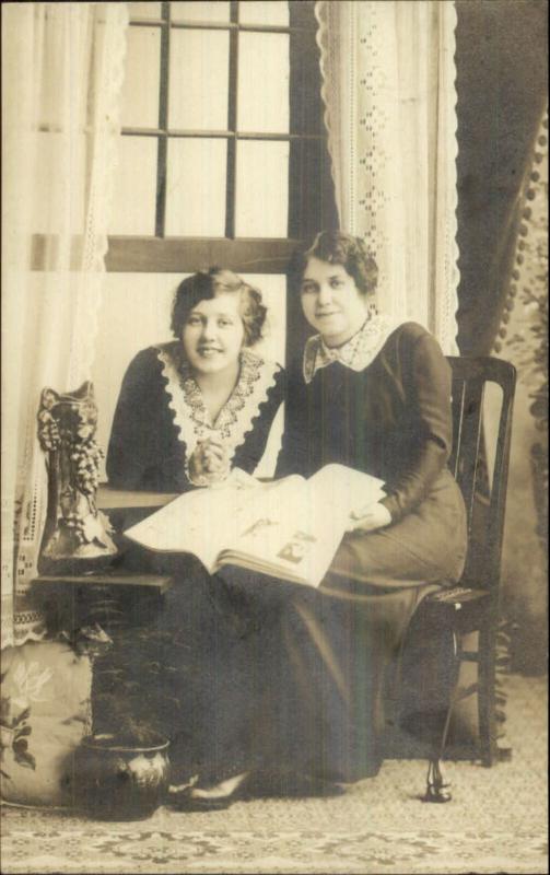 Women Sitting Posing w/ Magazine or Newspaper Unusual Statue Cat? RPPC