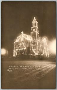 NORWICH CT CITY HALL at NIGHT 1909 ANTIQUE REAL PHOTO POSTCARD RPPC US FLAGS