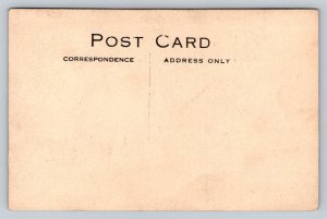 RPPC  The Boston Store  Massachusetts  Men on Bikes  c1910  Postcard