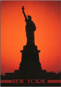 Postcard NYC Statue of Liberty silhouette at sunset