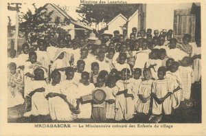 Community life Madagascar missionary surrounded by village native children 