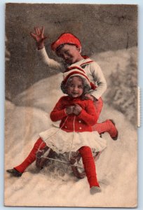 Christmas Children Sledding Winter Snow Scene Posted Antique Postcard