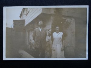 Devon SLAPTON Couple standing outside cottage c1938 RP Postcard by Jerome Ltd