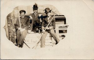 RPPC Canada Men with Rake Shovel & Broom Black Dog Bottles of Liquor 1907 M39