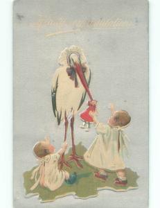 Pre-Linen GIRL HOLDS UP DOLL BESIDE STORK BIRD AC5680