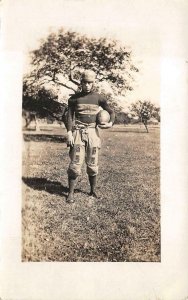 RPPC FOOTBALL PLAYER  SPORTS REAL PHOTO POSTCARD (c.1920)