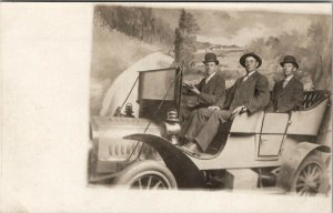 RPPC 3 Men In Studio Prop Automobile Countryside Backdrop c1915 Postcard U19