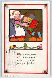 1914 Christmas Dutch Kids Kissing Hand Embossed Minneapolis Minnesota Postcard