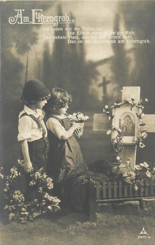 Old real photo postcard Am Elterngrab children couple pray parents grave