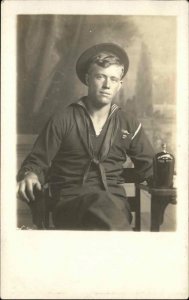 US Navy Sailor Uniform Studio w/ Bottle of Whisky Liquor Real Photo Postcard