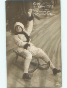 rppc 1920's PRETTY WOMAN RIDES ON TOBOGGAN SLED AC8457