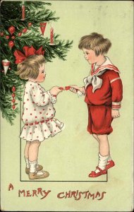 Tuck Christmas Children Little Boy and Girl Christmas Cracker c1910 Postcard