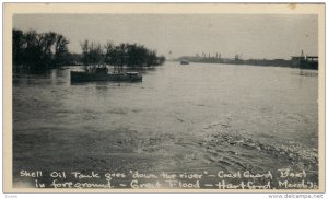 HARTFORD , Connecticut , 1936 ; Shell Oil Tank floating in Flood Waters