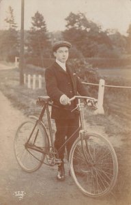 YOUNG MAN-BICYCLE CYCLIST-NOTE MECHANICAL FRONT BRAKE~1910s REAL PHOTO POSTCARD