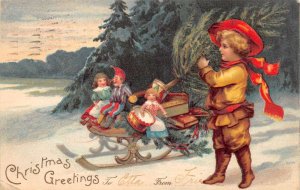 Christmas Greetings Boy with Sled and Toys Vintage Postcard AA74821