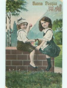 foreign Pre-Linen Easter GIRL AND BOY SITTING ON BRICKWALL AB4186