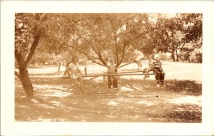 Real Photo Postcard Children on Seesaw