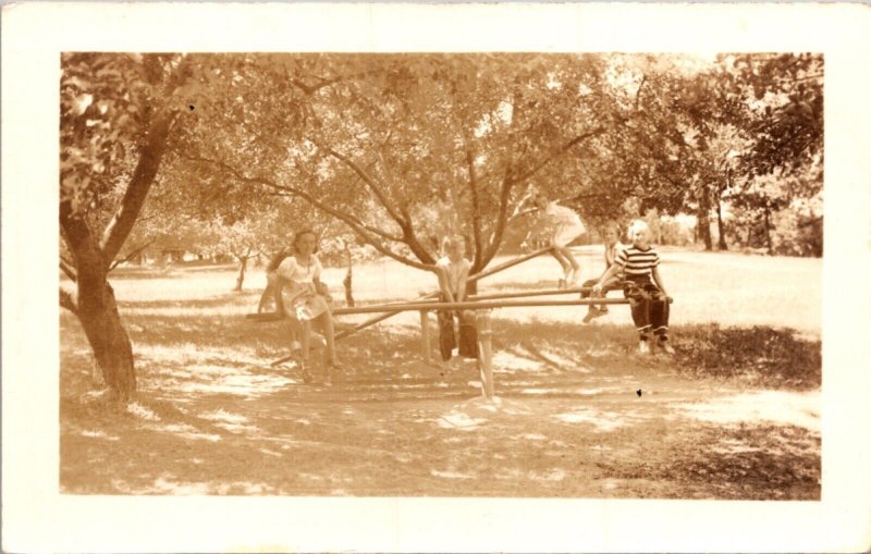 Real Photo Postcard Children on Seesaw