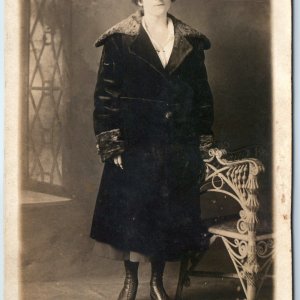 c1910s Woman Fur Hat Trimmed Coat RPPC Ornate Wicker Chair Studio Portrait Photo