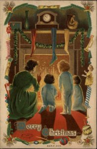 Christmas Mother and Children Fireplace Waiting for Santa Vintage Postcard