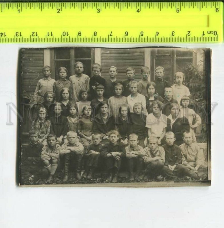 452350 USSR a group of children near a wooden house Old photo